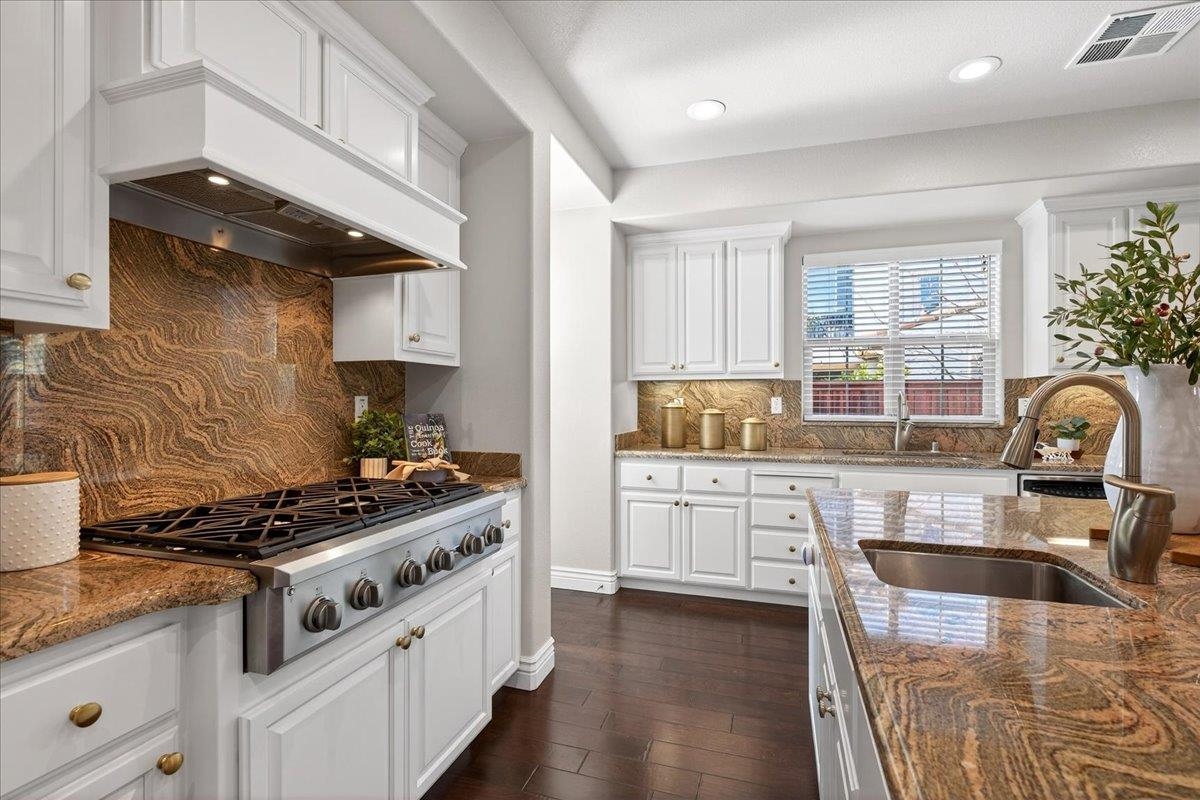 7035 Emerson Lane San Ramon, CA 94582 - Photo 18 of 60 a kitchen with stainless steel appliances granite countertop a stove and a sink