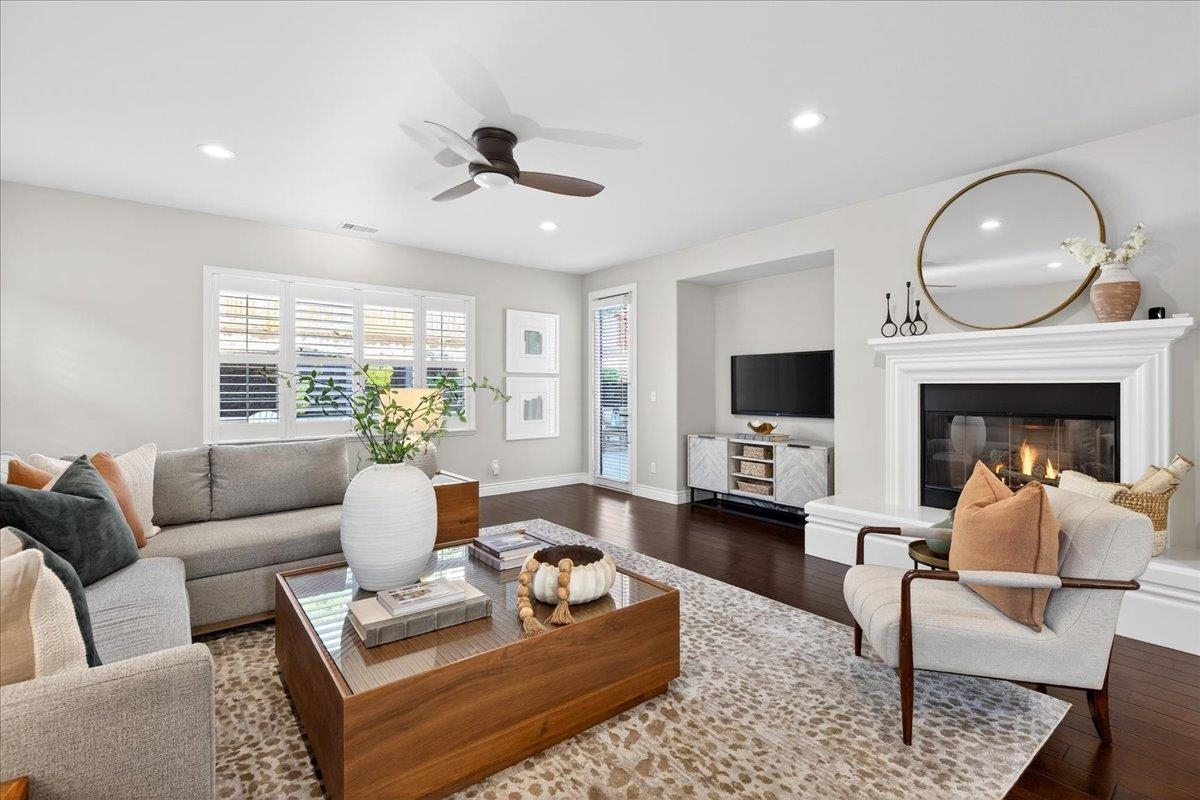 7035 Emerson Lane San Ramon, CA 94582 - Photo 22 of 60 a living room with furniture a fireplace a flat screen tv and a large window