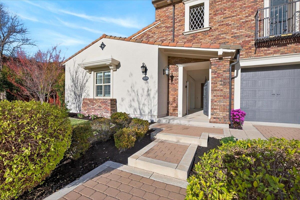 7035 Emerson Lane San Ramon, CA 94582 - Photo 5 of 60 a front view of a house with a yard and flowers
