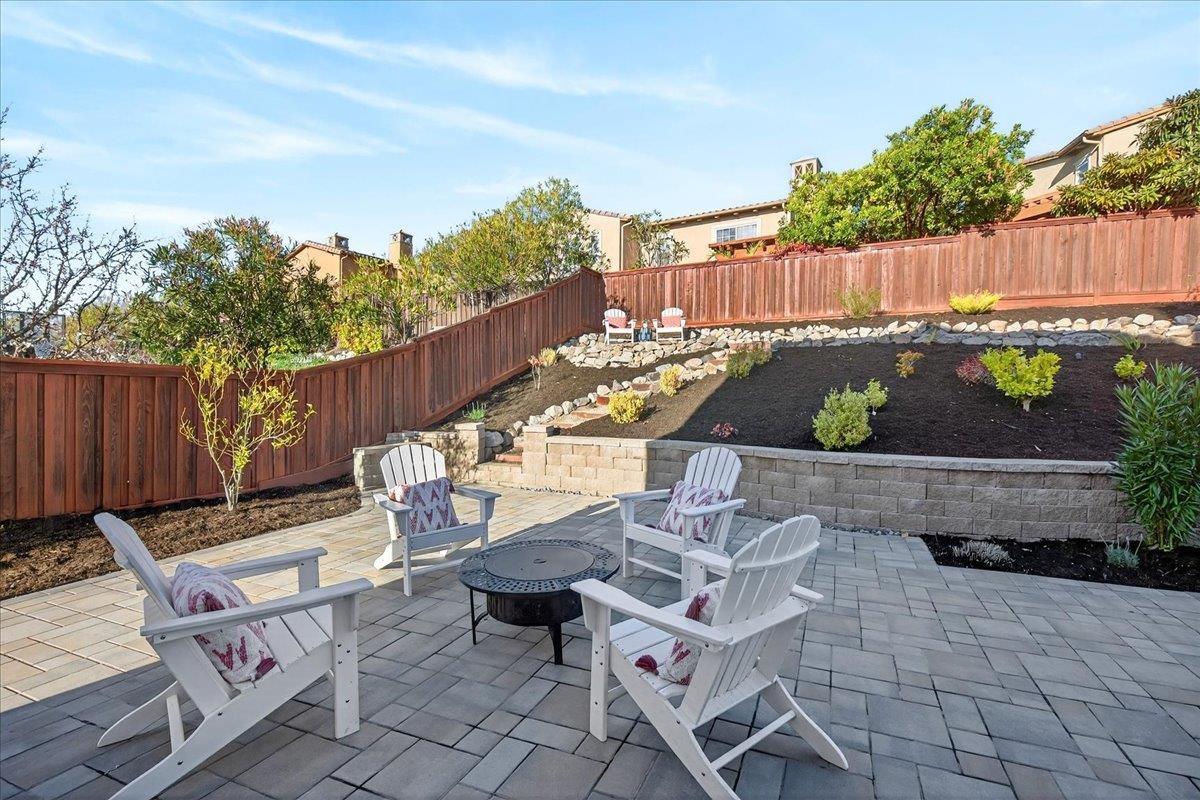 7035 Emerson Lane San Ramon, CA 94582 - Photo 53 of 60 a view of a patio with table and chairs potted plants with wooden fence