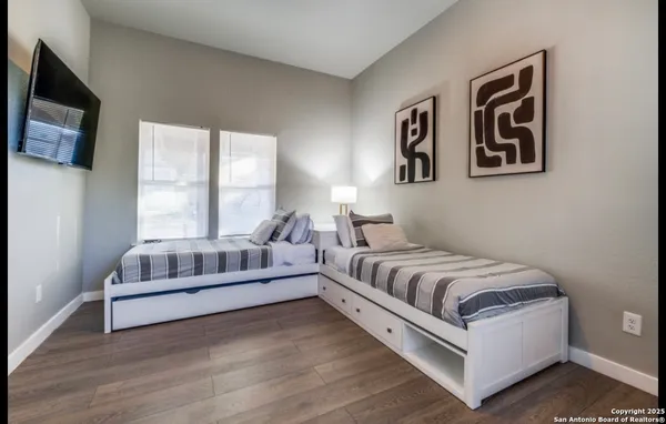 a spacious bedroom with a bed and a couch