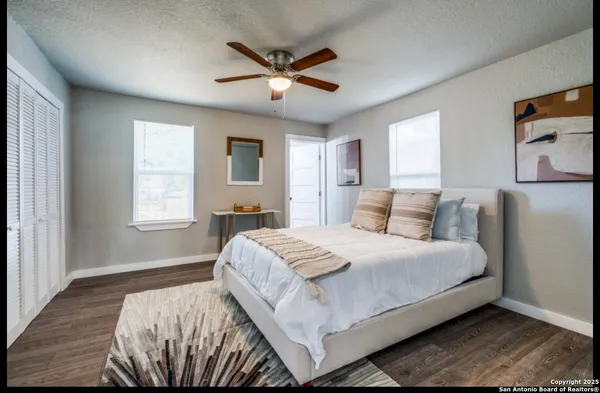 a bedroom with a bed and window