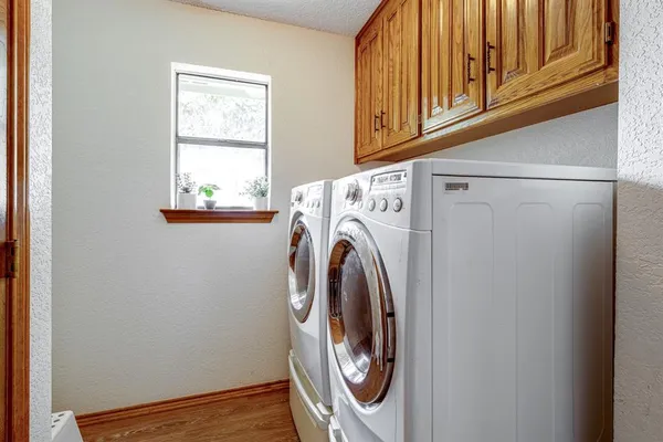 a utility room with dryer and washer