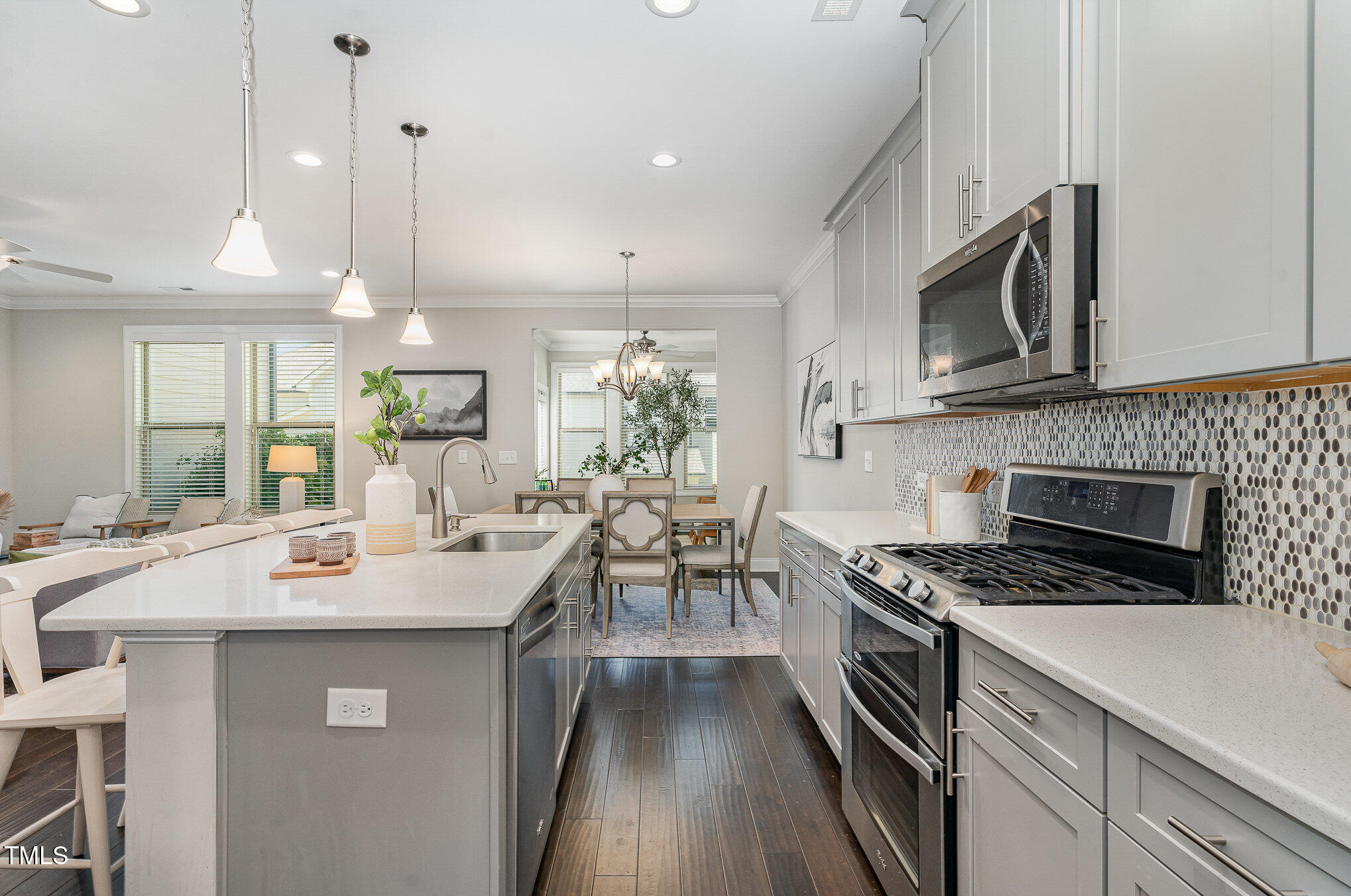 1314 Catch Fly Lane Durham, NC 27713 - Photo 10 of 31 a kitchen with a sink a stove and chairs