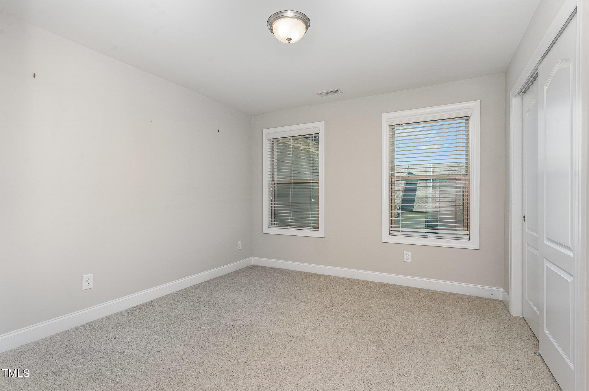 1314 Catch Fly Lane Durham, NC 27713 - Photo 21 of 31 an empty room with a window