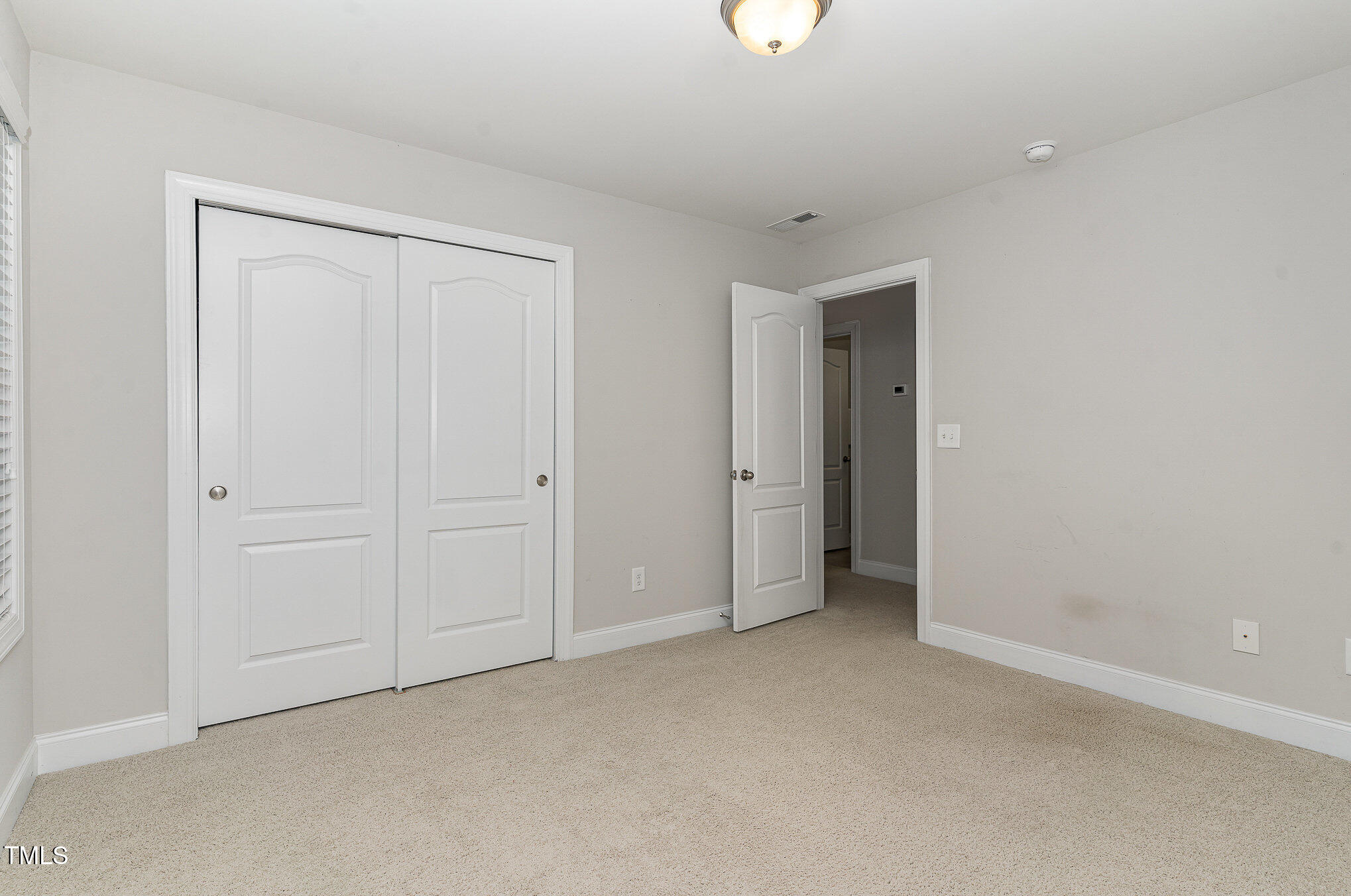 1314 Catch Fly Lane Durham, NC 27713 - Photo 22 of 31 an empty room with closet area
