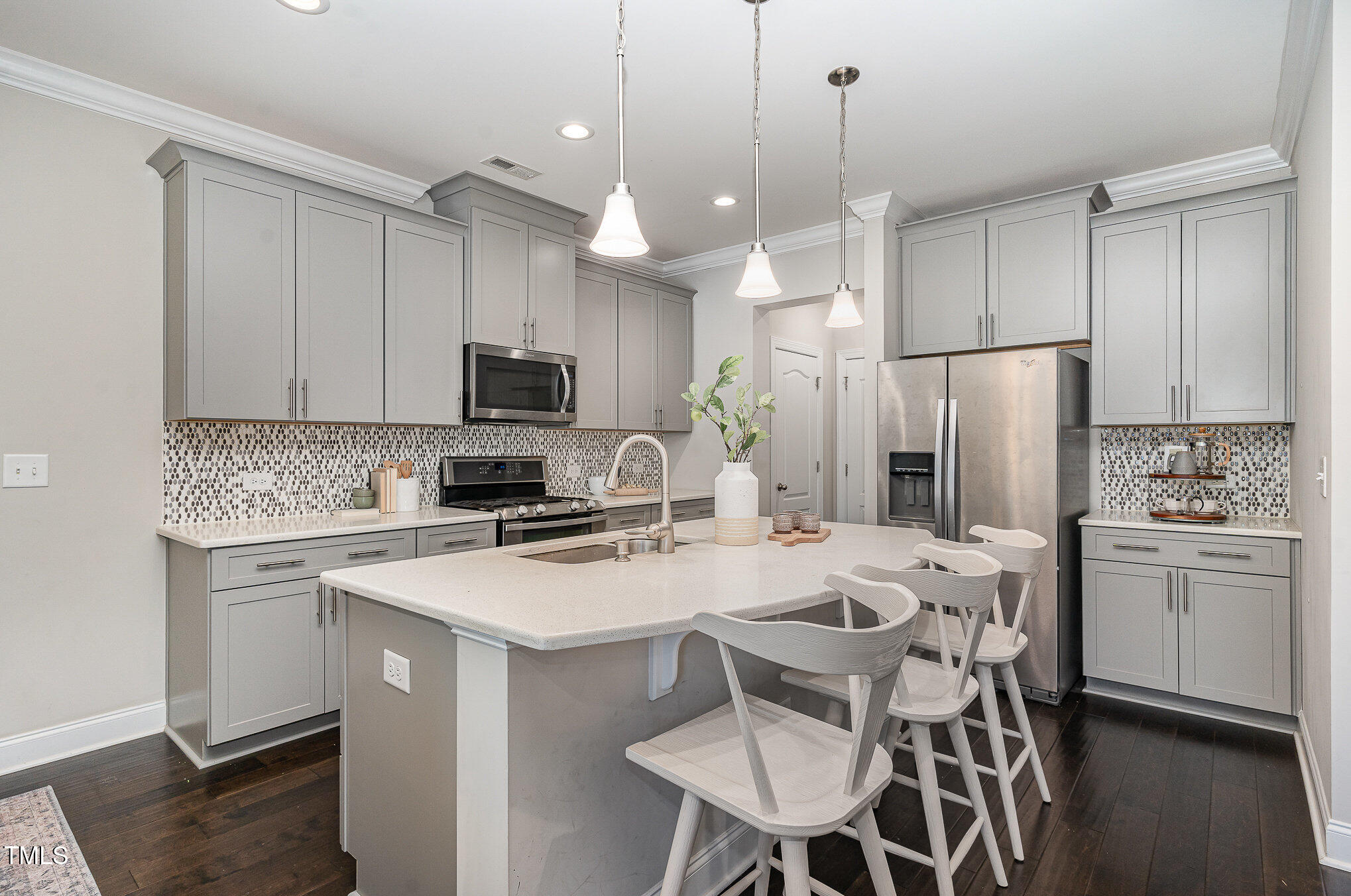 1314 Catch Fly Lane Durham, NC 27713 - Photo 3 of 31 a kitchen with a refrigerator a stove a sink and a refrigerator