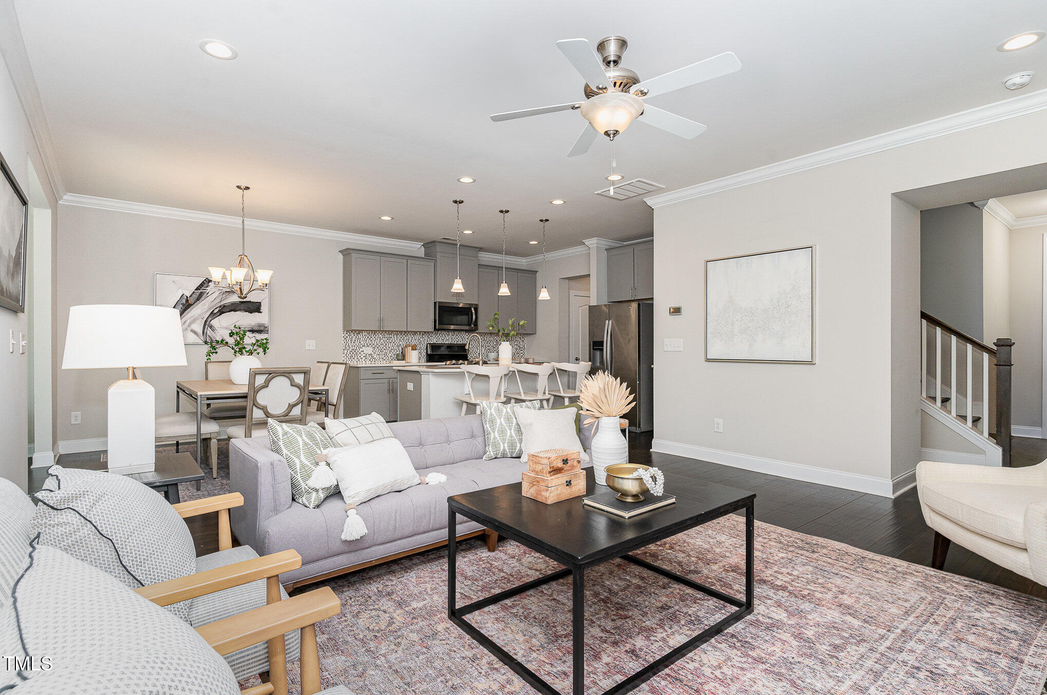 1314 Catch Fly Lane Durham, NC 27713 - Photo 7 of 31 a living room with furniture kitchen view and a chandelier