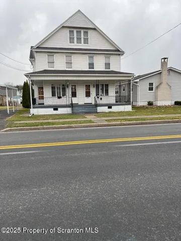 a front view of residential houses with outdoor space and