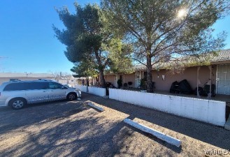 a view of a yard with car parked