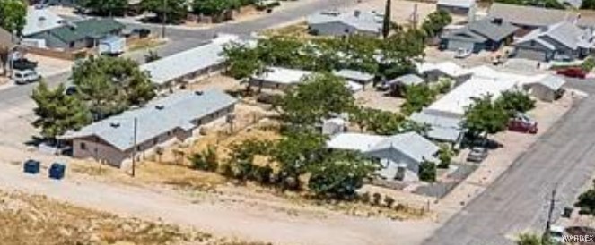 1401 Main Street Kingman, AZ 86401 - Photo 2 of 3 an aerial view of a house with a yard