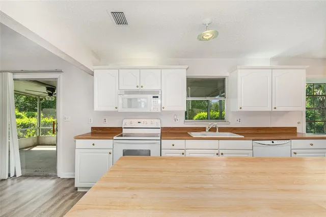 a kitchen with a cabinets and window