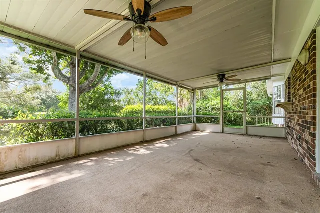 a view of outdoor space with sliding windows