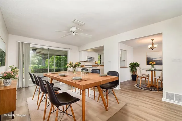 a view of a dining room with furniture window and wooden floor