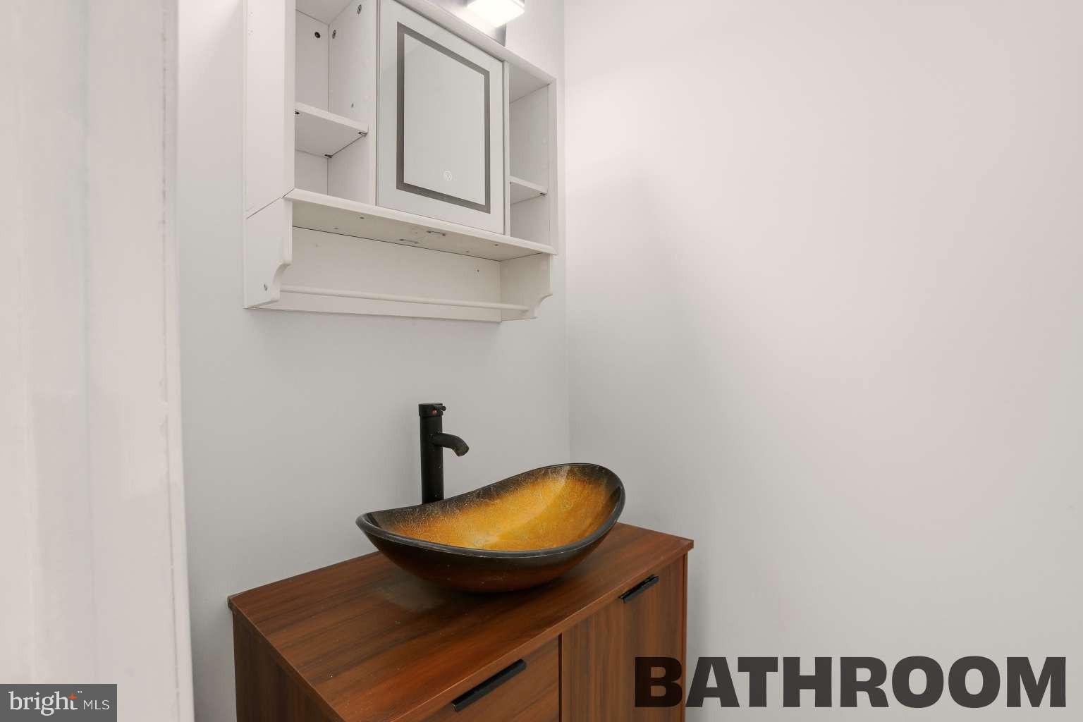 960 Jamestown Road Hightstown, NJ 08520 - Photo 12 of 18 a bathroom with a toilet and a sink