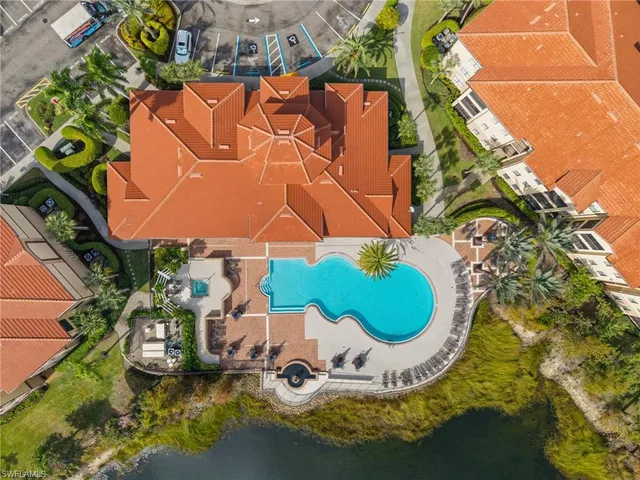 an aerial view of a house with a swimming pool