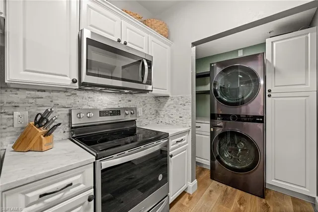 a kitchen with a stove and a microwave