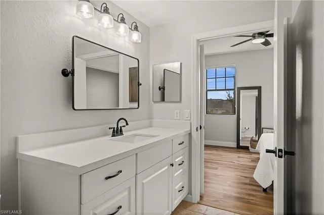 a bathroom with a double vanity sink mirror and