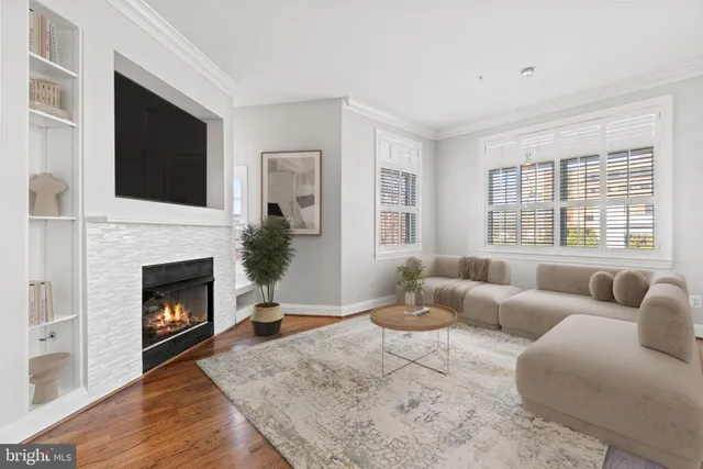a living room with furniture fireplace and flat screen tv