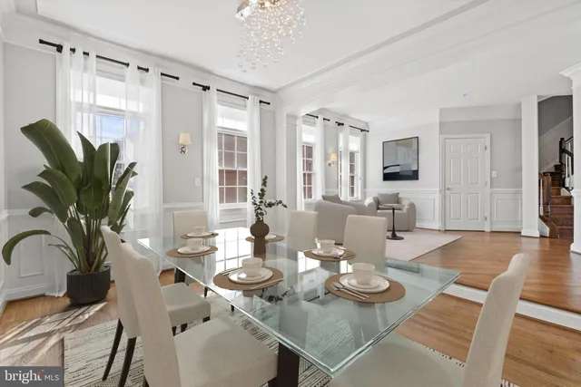 a view of a dining room with furniture window and wooden floor