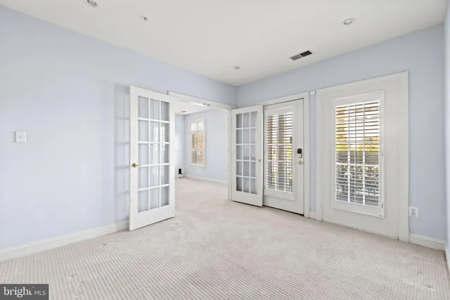 an empty room with windows