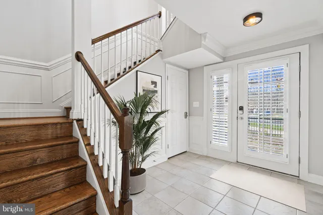 a view of entryway with stairs and wooden floor