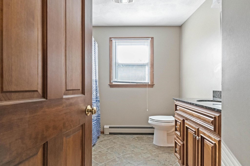 2 Little Farm Road Lakeville, MA 02347 - Photo 17 of 39 a bathroom with a sink a toilet and a mirror