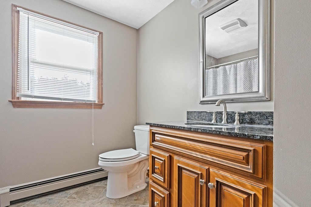 2 Little Farm Road Lakeville, MA 02347 - Photo 19 of 39 a bathroom with a toilet a sink and a mirror
