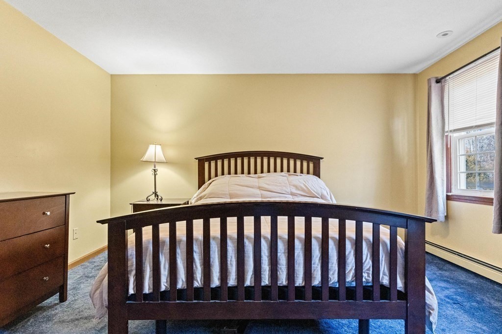 2 Little Farm Road Lakeville, MA 02347 - Photo 22 of 39 a bedroom with a bed and wooden floor