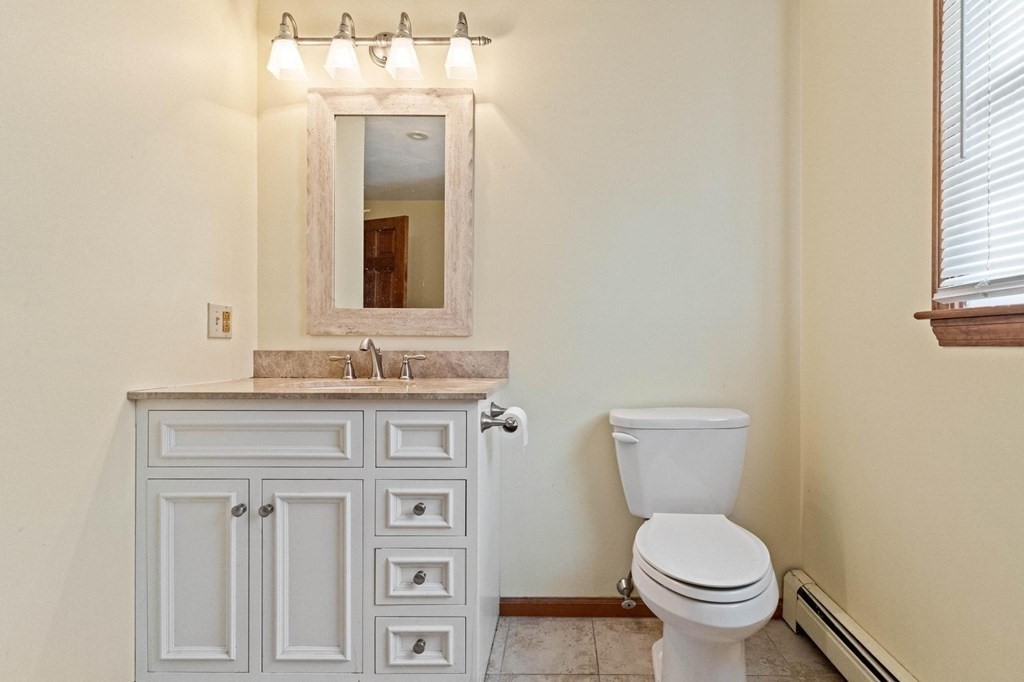 2 Little Farm Road Lakeville, MA 02347 - Photo 23 of 39 a bathroom with a granite countertop toilet a sink and mirror