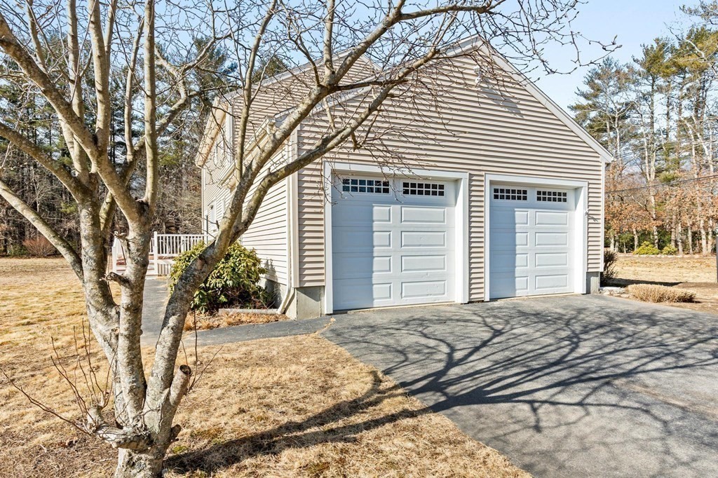2 Little Farm Road Lakeville, MA 02347 - Photo 30 of 39 a front view of a house with a yard and garage