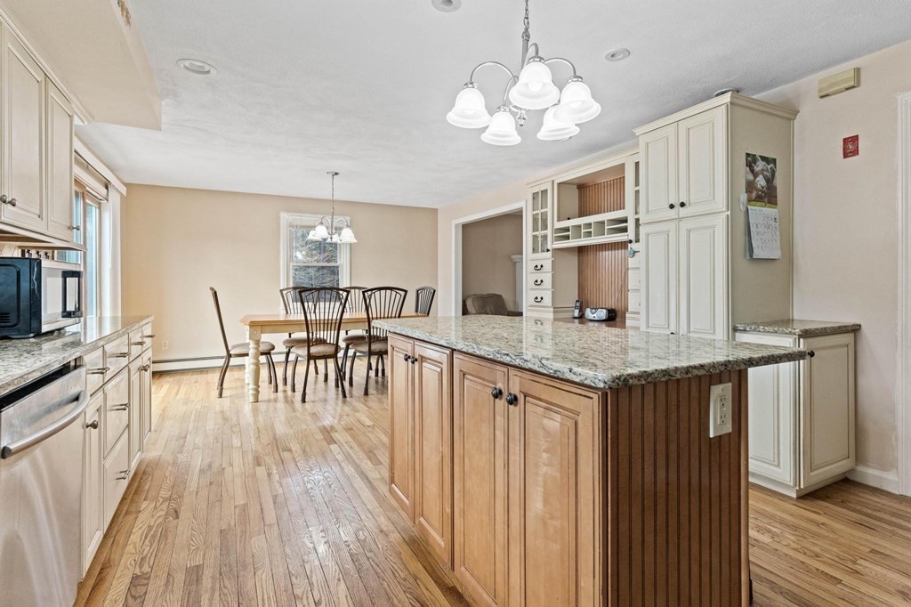2 Little Farm Road Lakeville, MA 02347 - Photo 4 of 39 a view of a kitchen with kitchen island granite countertop wooden floor and stainless steel appliances