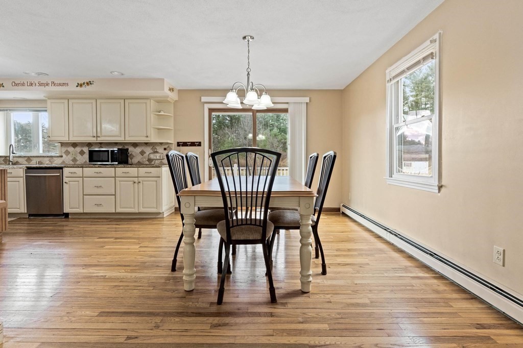 2 Little Farm Road Lakeville, MA 02347 - Photo 6 of 39 a dining room with furniture a chandelier and wooden floor