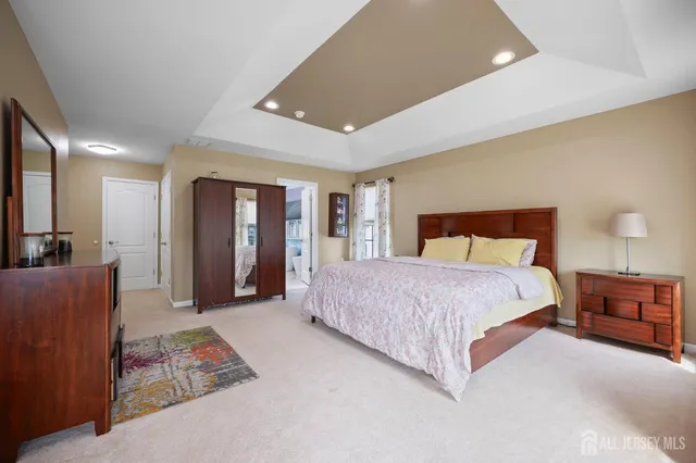 a bedroom with a large bed and furniture