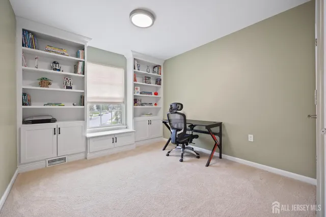 a view of workspace with wooden floor and windows