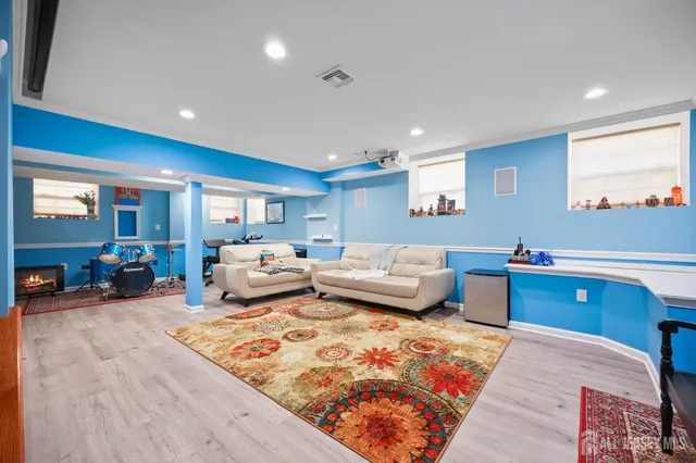 a bed room with furniture and a lamp