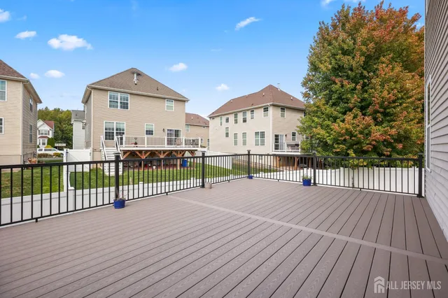 a view of a house with wooden deck