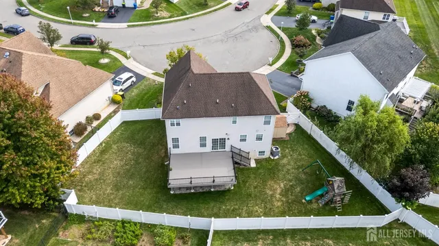 an aerial view of house with a swimming pool