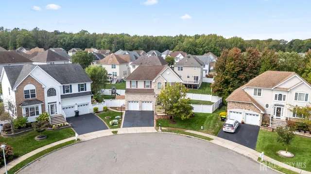 an aerial view of a house with a garden and plants