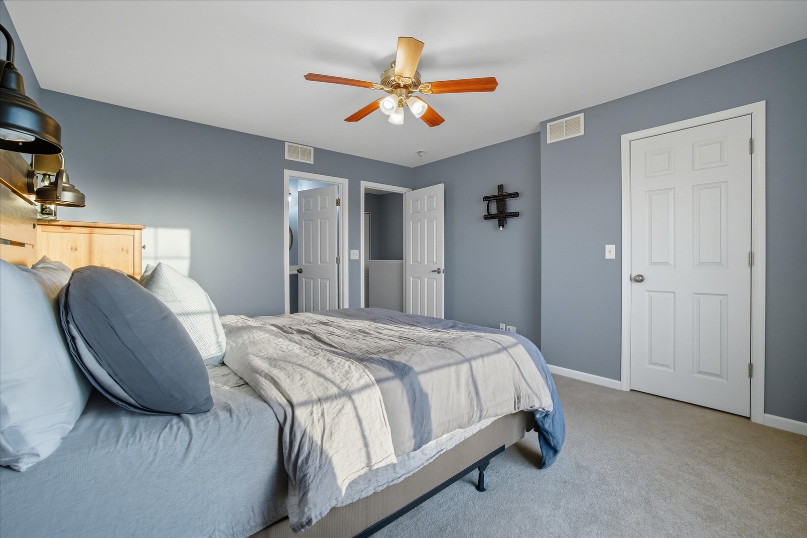 819 Daniel Drive Minooka, IL 60447 - Photo 12 of 33 a bed room with a bed and a ceiling fan