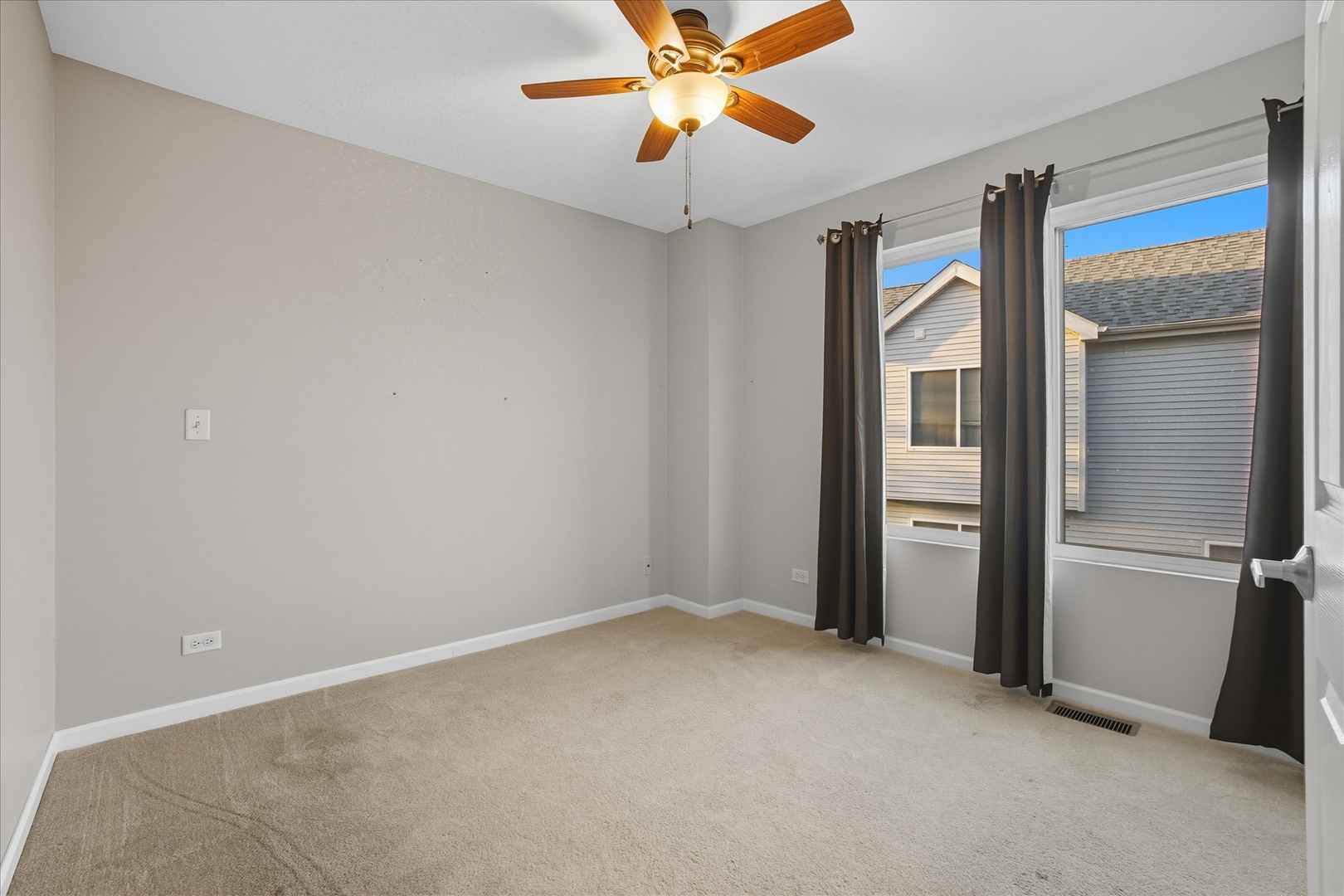 819 Daniel Drive Minooka, IL 60447 - Photo 14 of 33 an empty room with closet and a chandelier fan