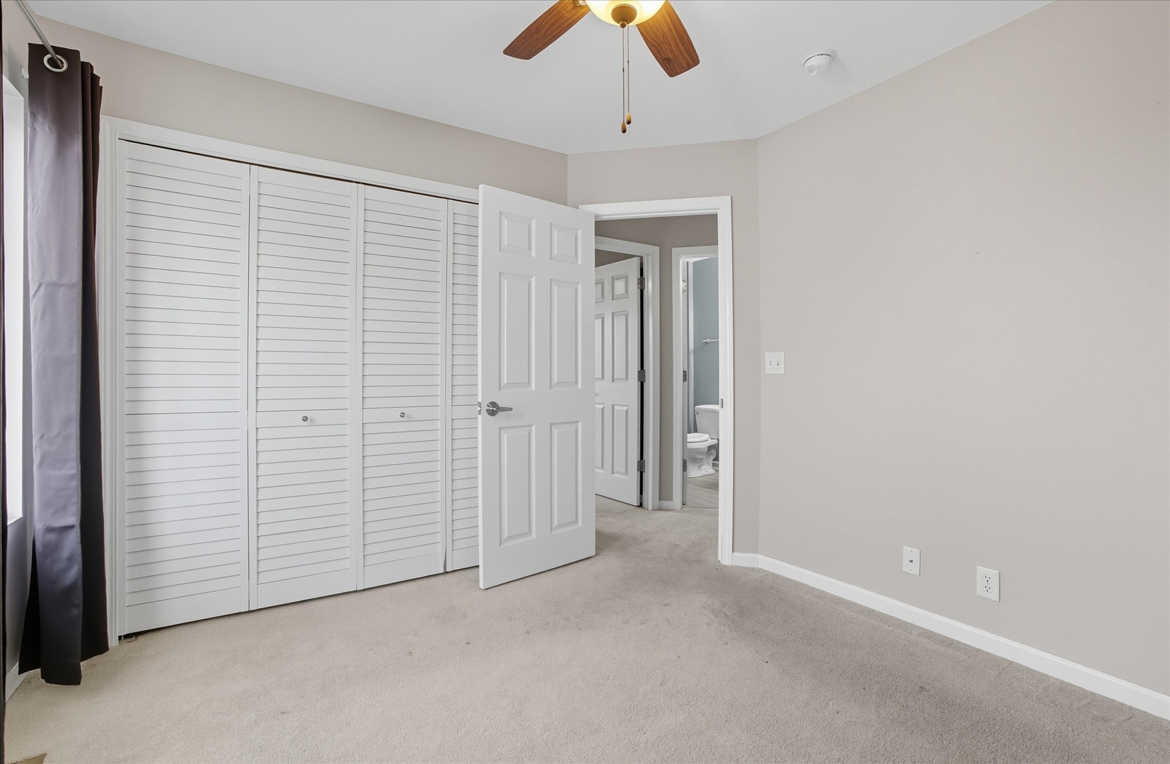 819 Daniel Drive Minooka, IL 60447 - Photo 15 of 33 an empty room with chandelier fan