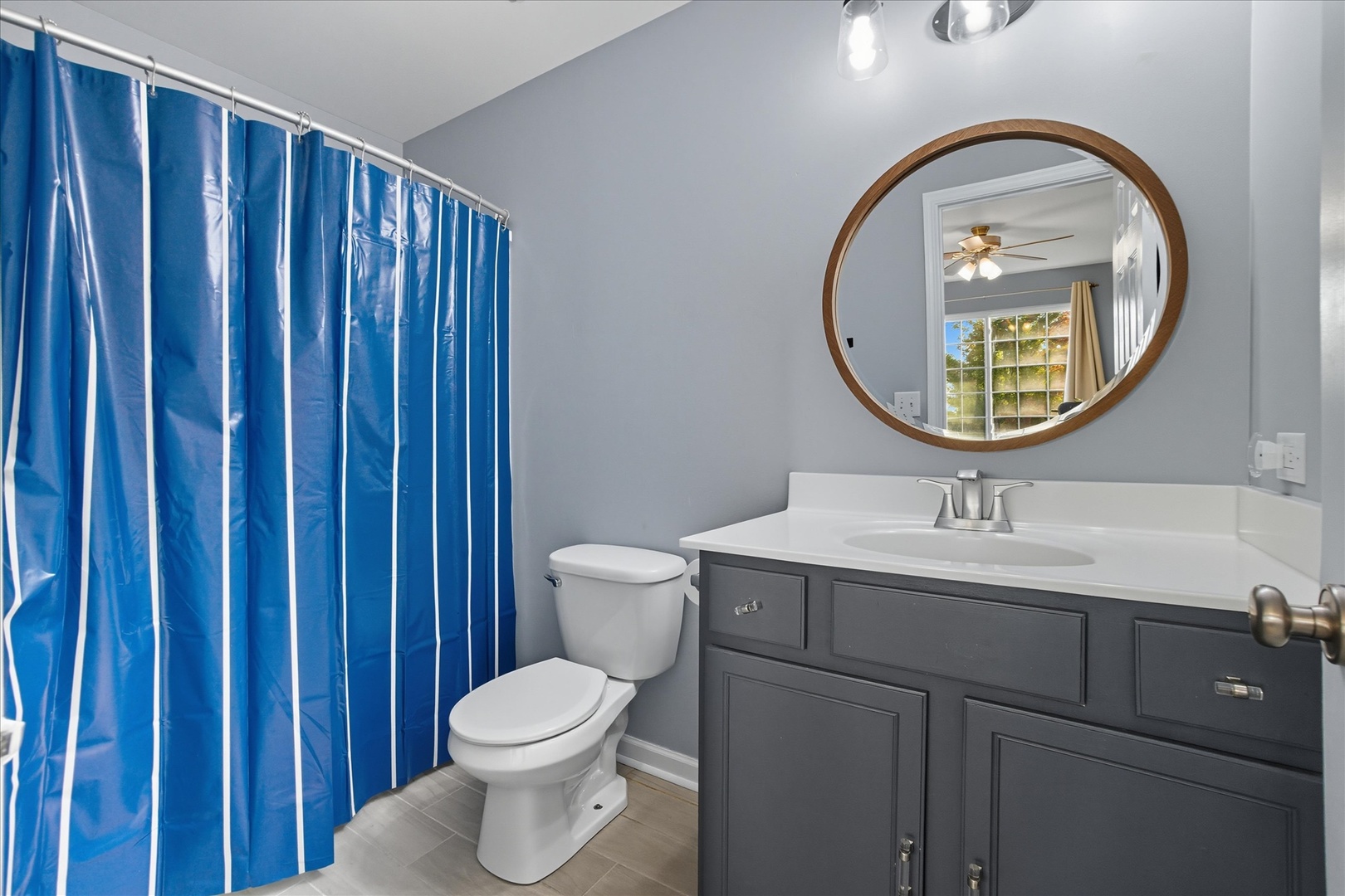 819 Daniel Drive Minooka, IL 60447 - Photo 16 of 33 a bathroom with a toilet a sink and a mirror