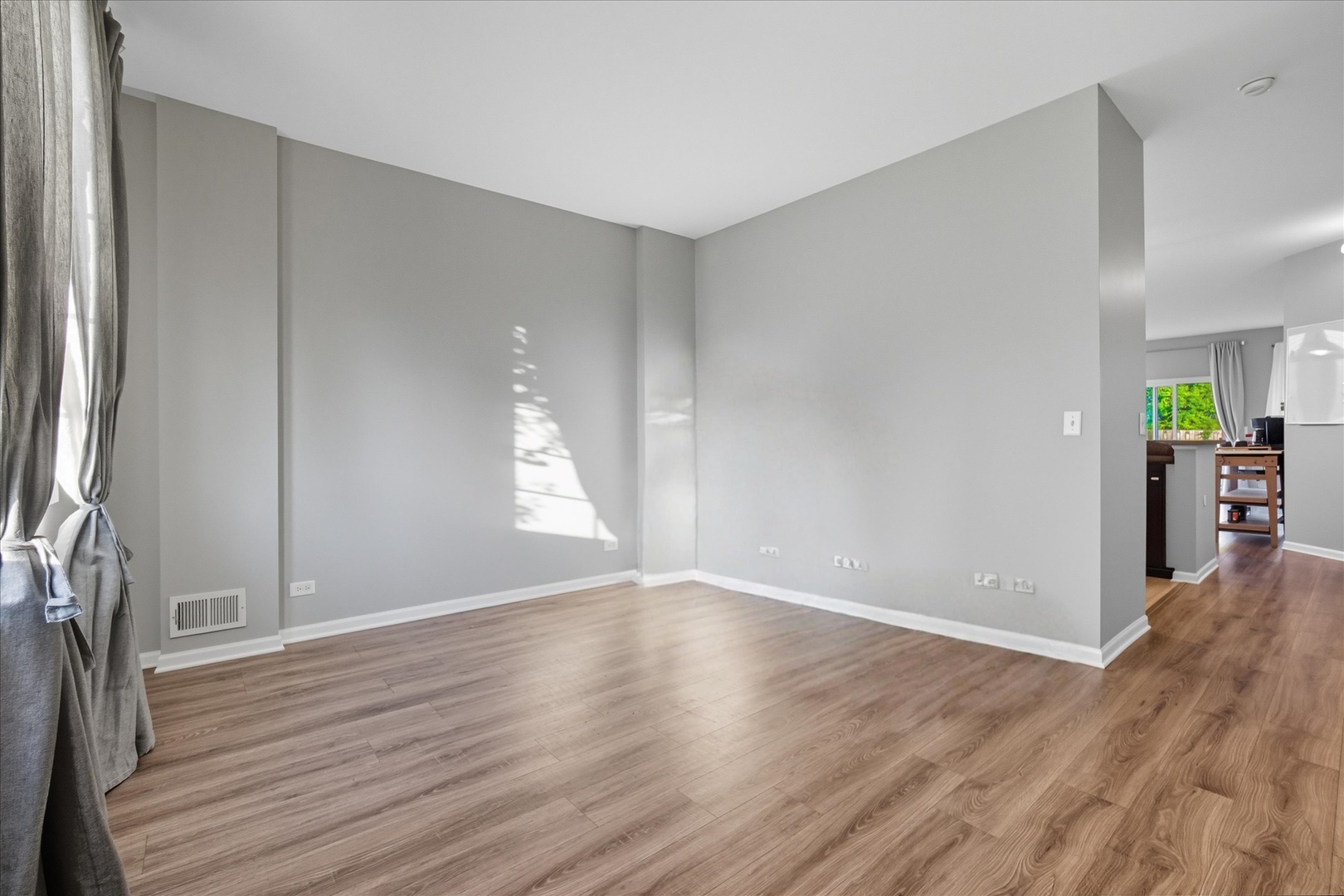 819 Daniel Drive Minooka, IL 60447 - Photo 21 of 33 an empty room with wooden floor and windows