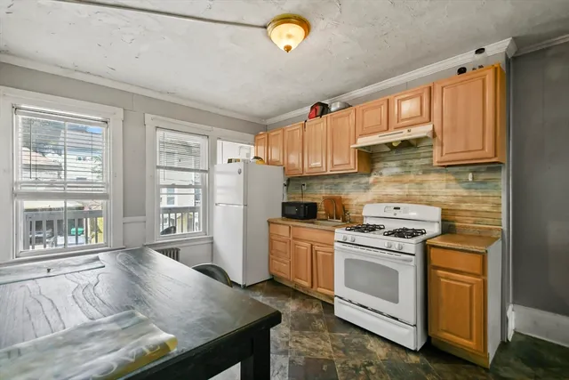 a bedroom with a bed and a baby crib