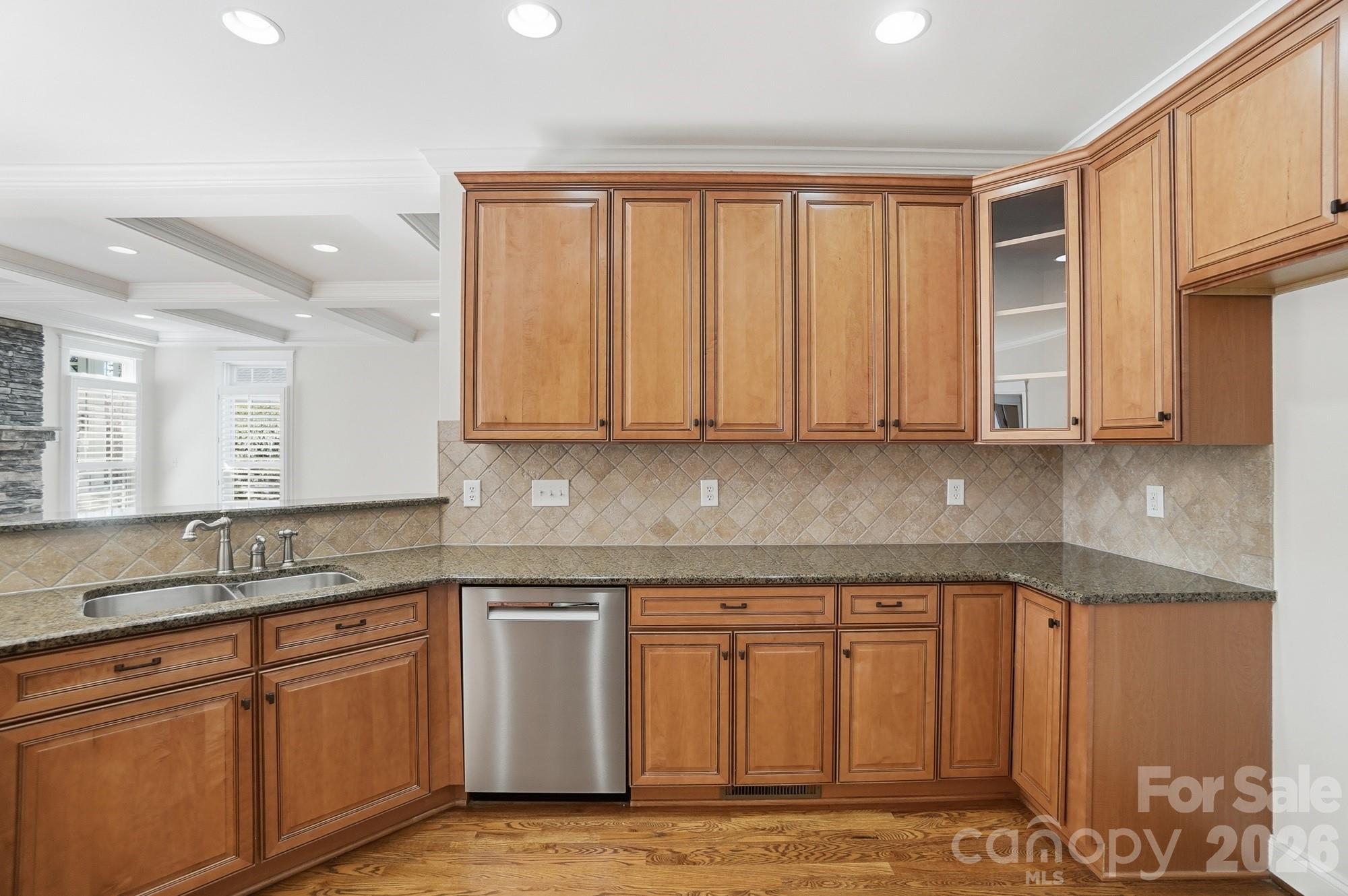 159 Lavender Bloom Loop Mooresville, NC 28115 - Photo 18 of 48 a white kitchen with granite countertop stainless steel appliances