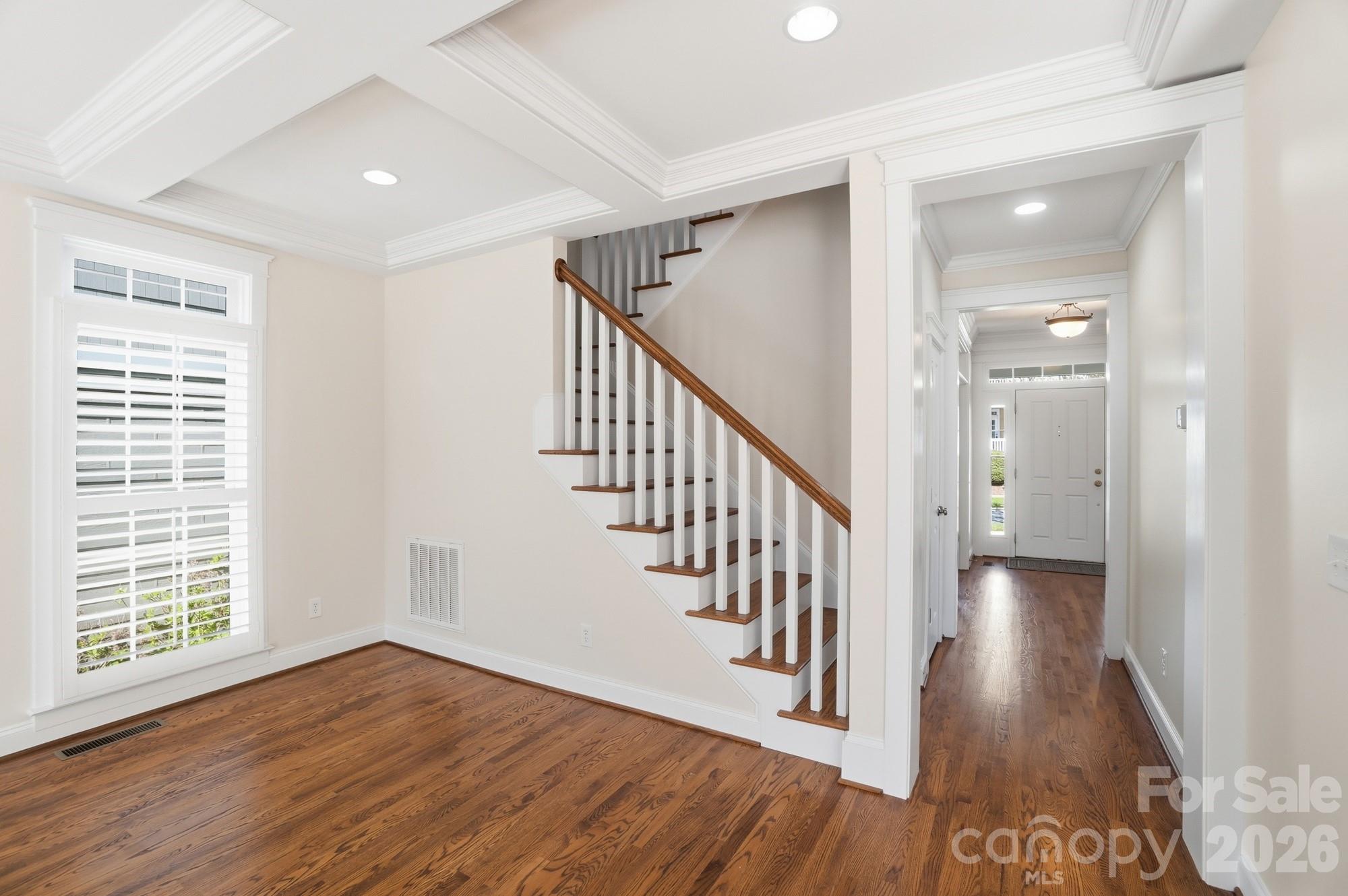 159 Lavender Bloom Loop Mooresville, NC 28115 - Photo 20 of 48 a view of a hallway with wooden floor and windows