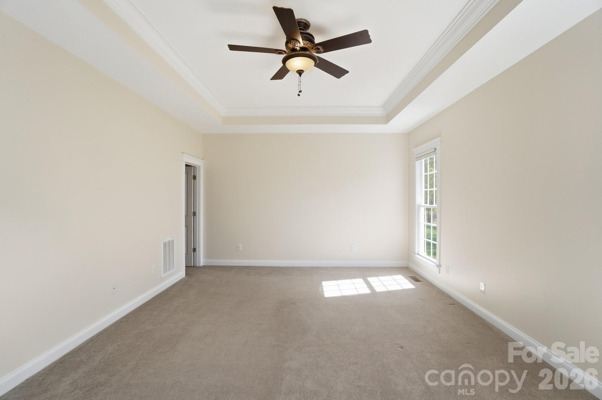 159 Lavender Bloom Loop Mooresville, NC 28115 - Photo 22 of 48 an empty room with windows and fan