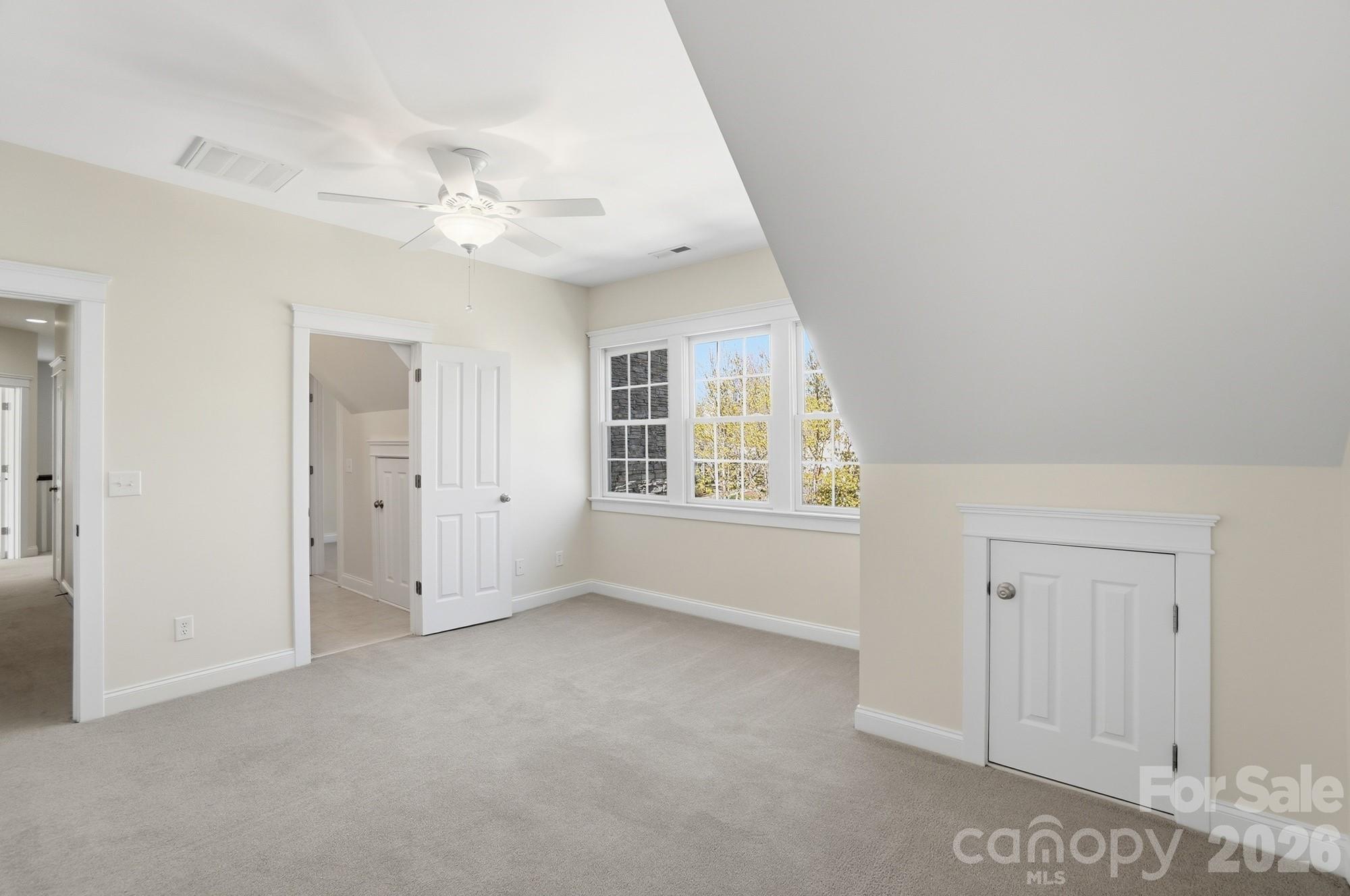 159 Lavender Bloom Loop Mooresville, NC 28115 - Photo 32 of 48 an empty room with windows and fan