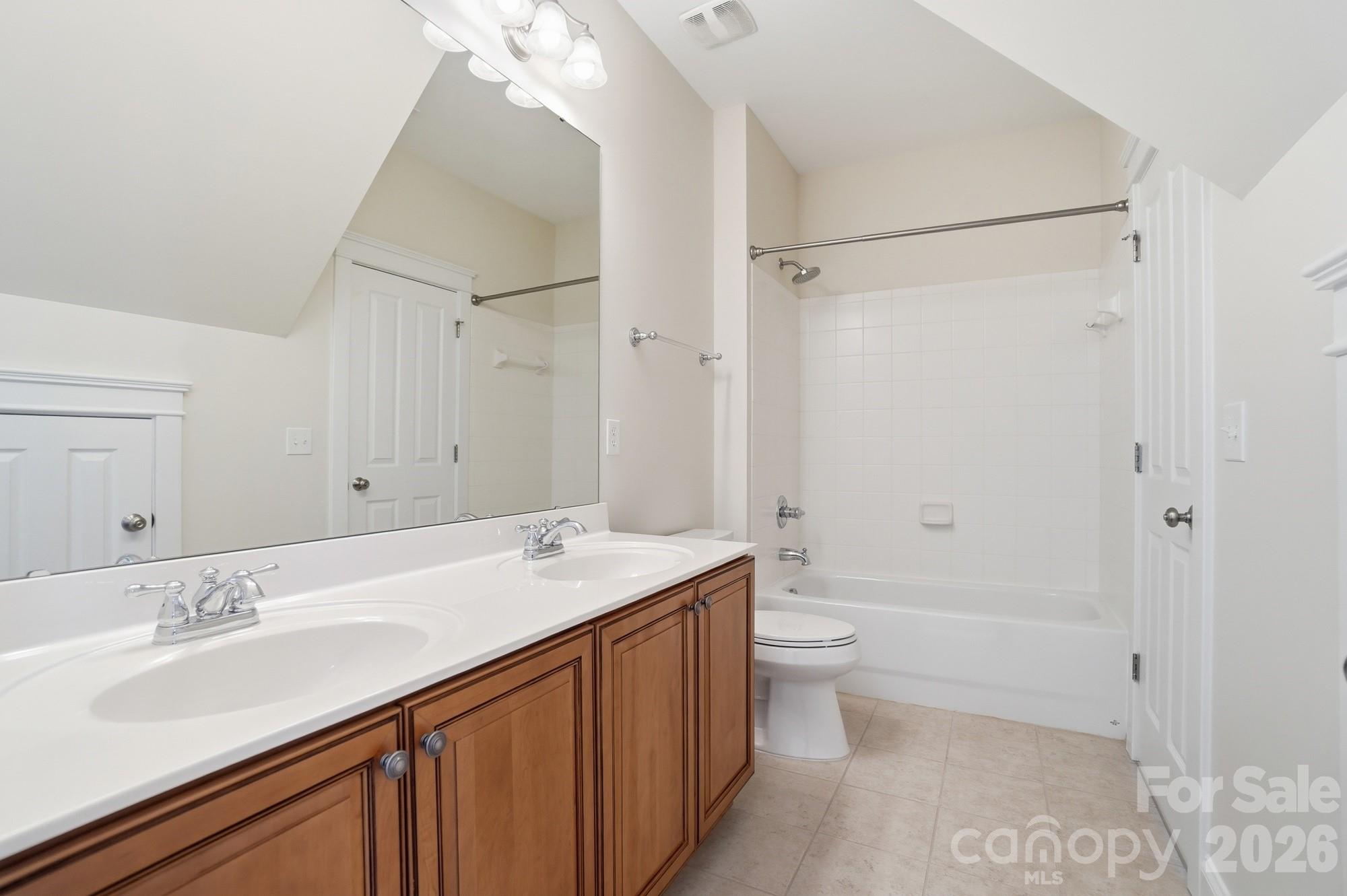159 Lavender Bloom Loop Mooresville, NC 28115 - Photo 35 of 48 a bathroom with a sink a toilet and shower